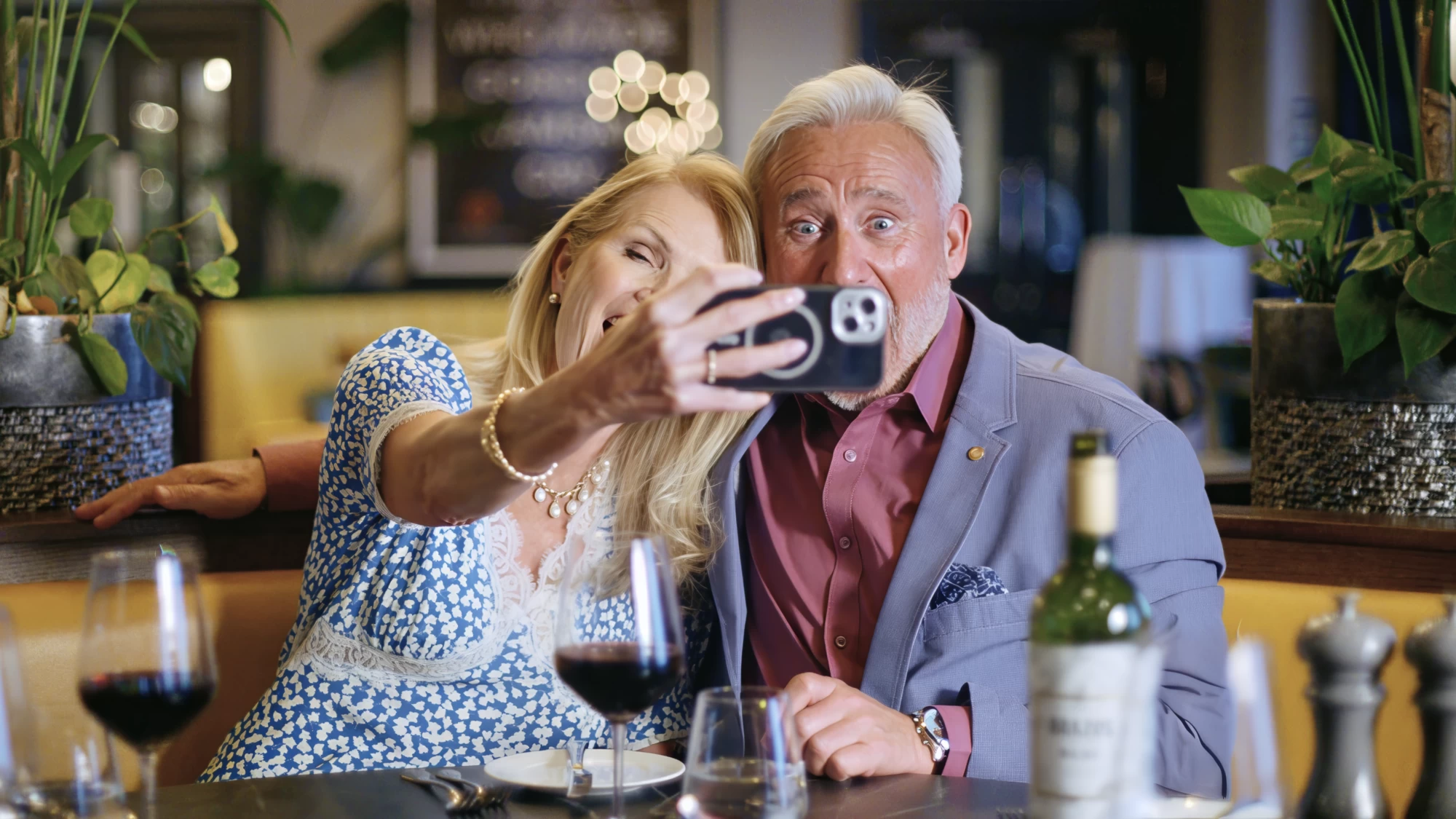 Visit Kent tourism photography — empty-nester couple taking a selfie over dinner and wine